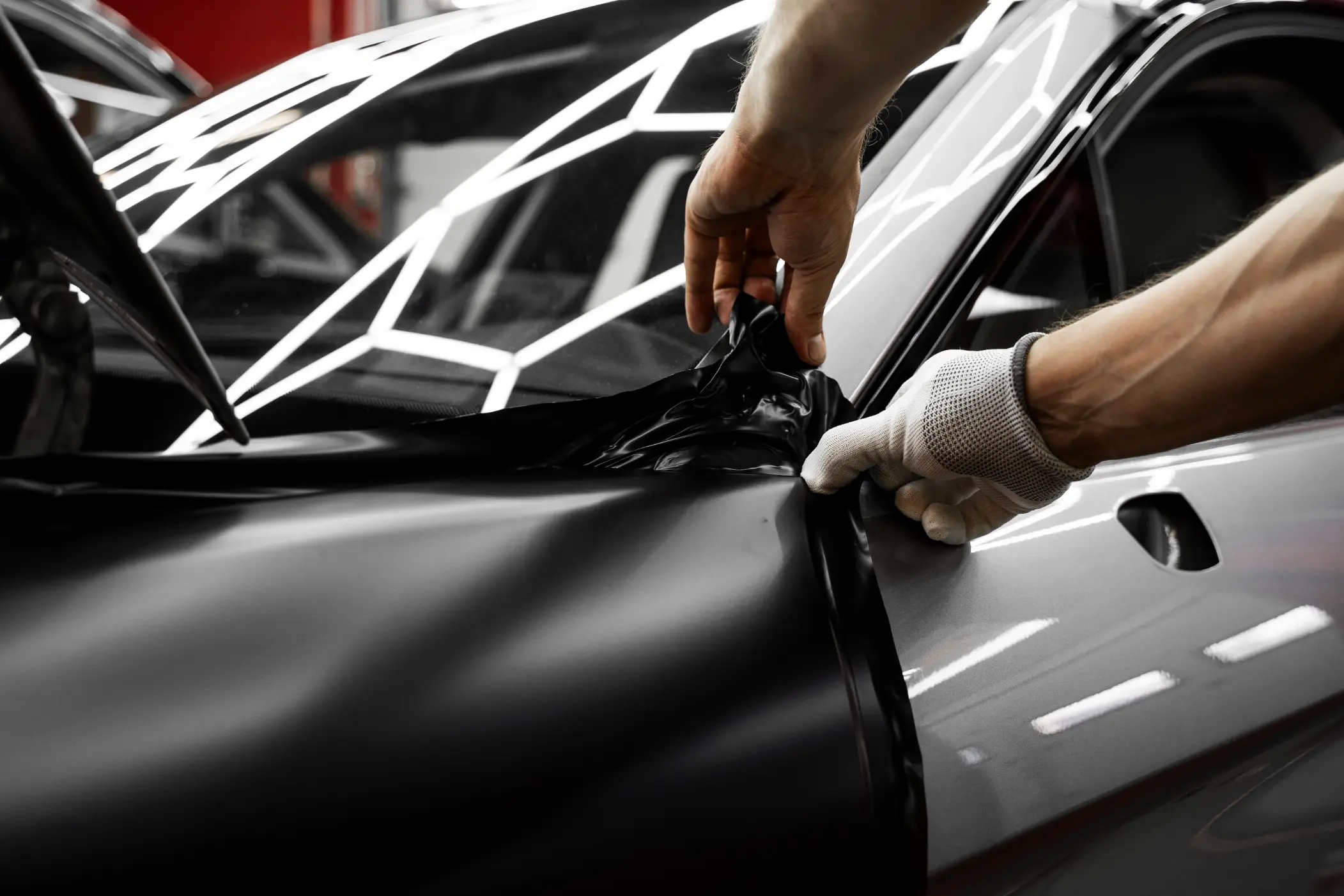 Auto ceramic coating being applied to a car in a Pinellas County, FL driveway